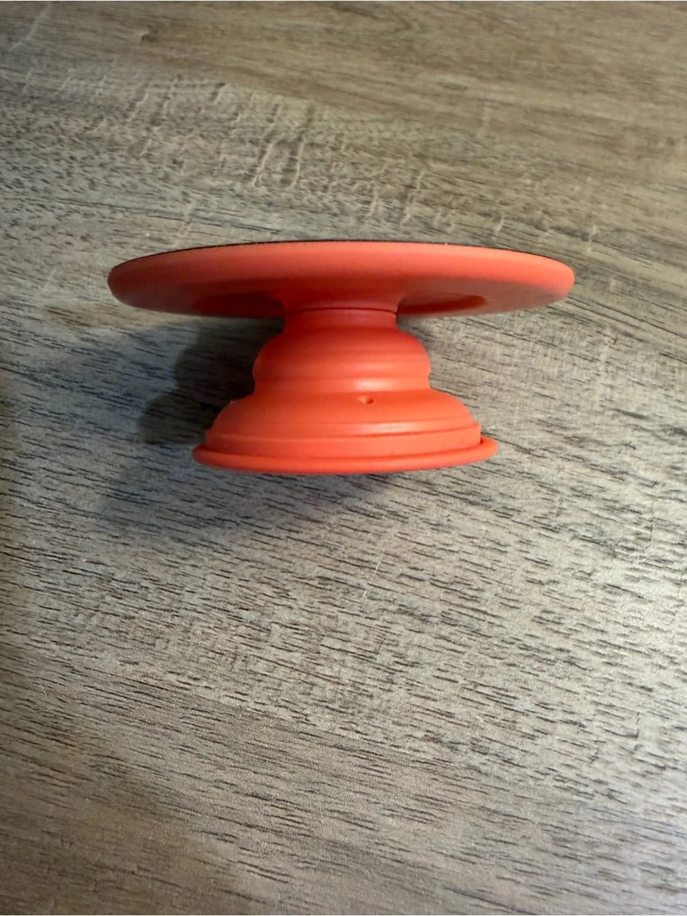 Anker Coral Orange Power Bank, Satechi Magnetic Wallet Stand, and Pop Socket